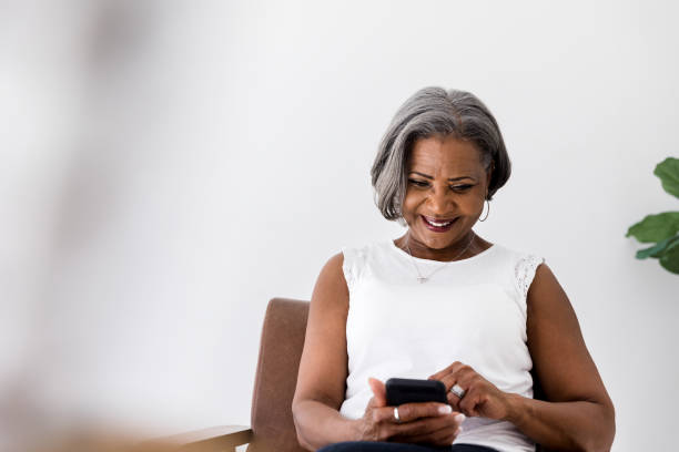 istock Senior woman shops online 1215188836