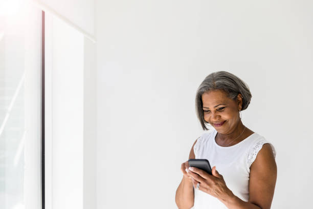 istock Woman shops online with smartphone 1215188841