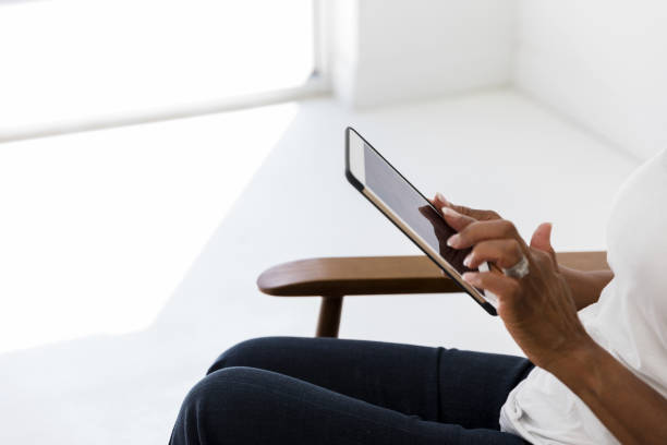 istock Unrecognizable woman uses digital tablet 1215188843