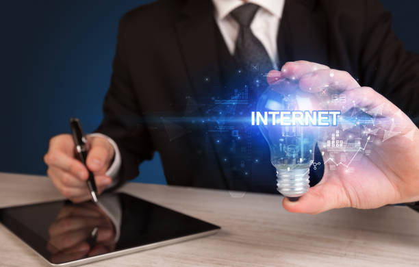 istock Businessman holding a light bulb 1215192370