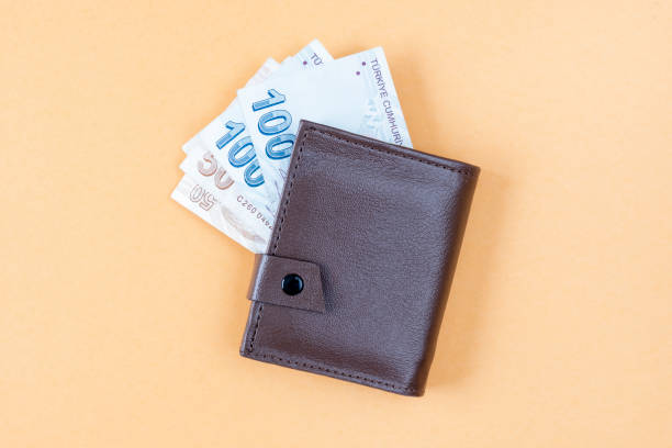istock wallet with money isolated on white background 1215192550