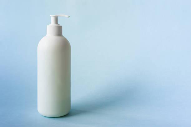 istock Mock up of white soap bottle on blue background 1215192729