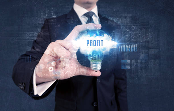 istock Businessman holding a light bulb, business concept 1215193599