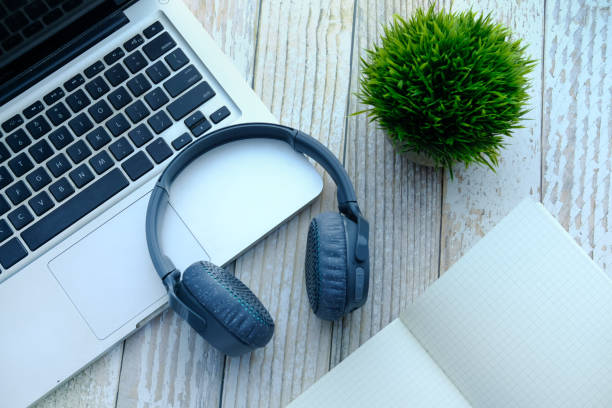 istock Headset or headphone on laptop, top view 1215193687
