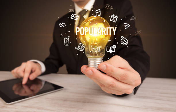 istock Businessman holding a light bulb, social media concept 1215193897