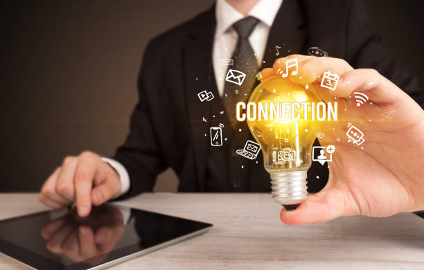 istock Businessman holding a light bulb, social media concept 1215194172