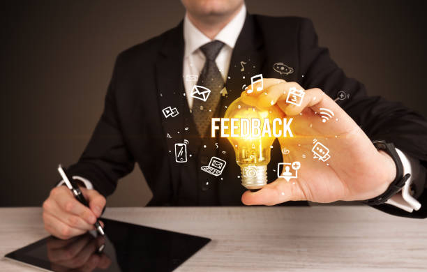 istock Businessman holding a light bulb, social media concept 1215195064