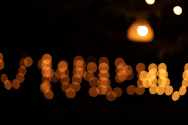 istock Lamp light and bokeh on night time background 1215197752