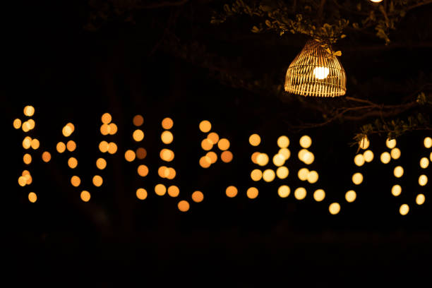 istock Lamp light and bokeh on night time background 1215197758