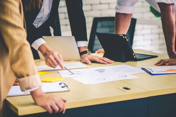 istock Business team meeting or brainstorming and discussing with financial data and analyzing report graph at office. Teamwork meeting and partnership conference working concept. 1215197823