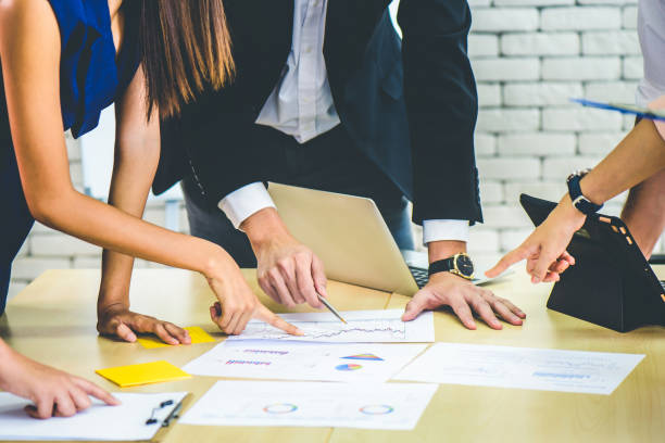 istock Business team meeting or brainstorming and discussing with financial data and analyzing report graph at office. Teamwork meeting and partnership conference working concept. 1215197838