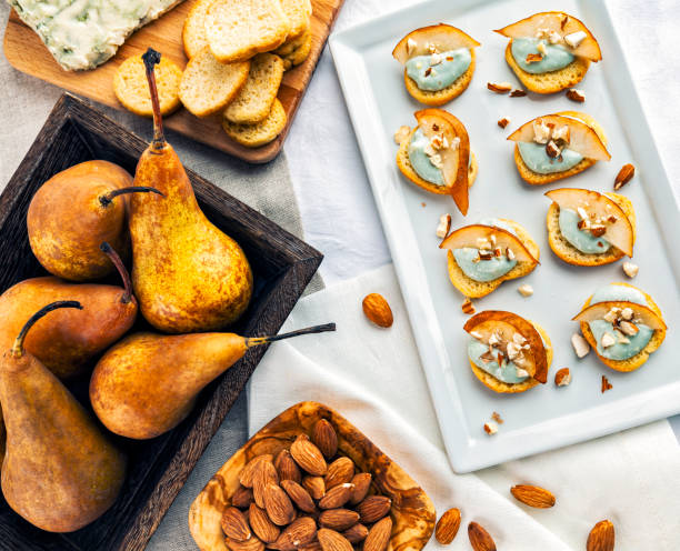 Tapas of blue cheese, pears and slivered almonds stock photo