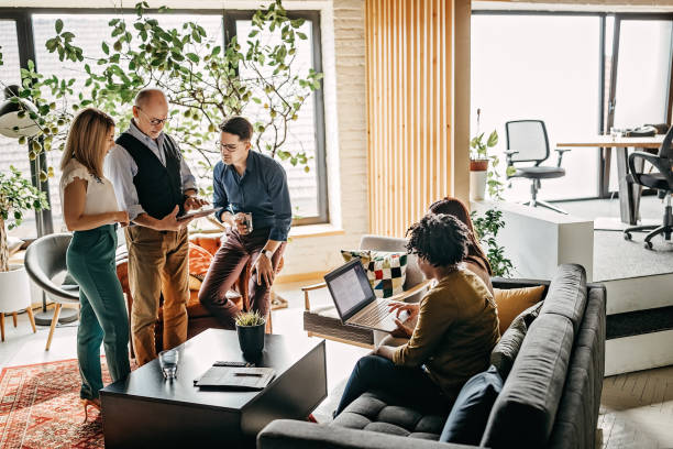 istock Professional Business Team Making Plans In Two Groups At Office 1215200345