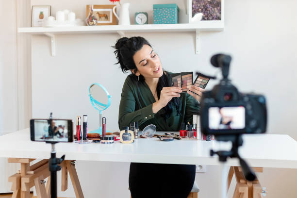istock Woman Vlogging Herself About Beauty Products 1215201311