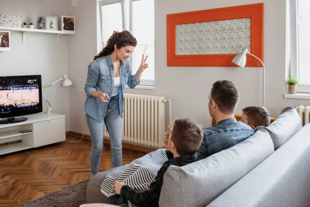 istock Happy Family Playing Charades Together 1215201458