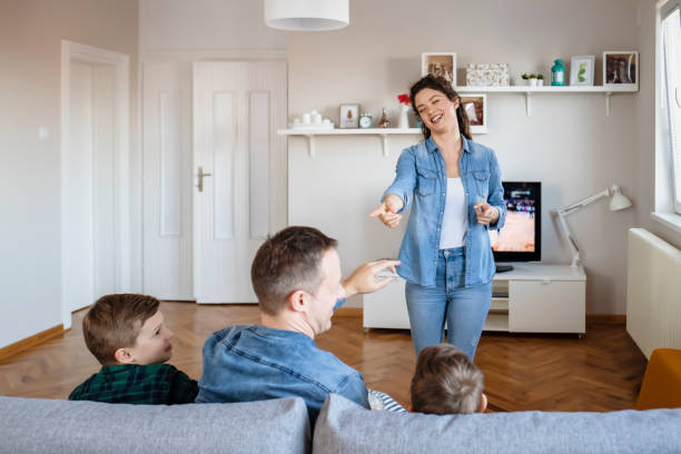 istock Happy Family Playing Charades Together 1215201500