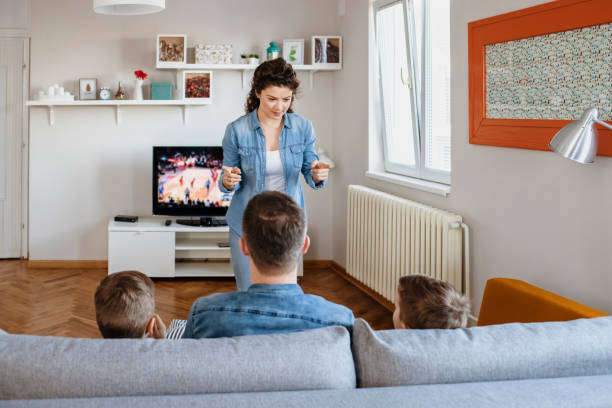 istock Happy Family Playing Charades Together 1215201518