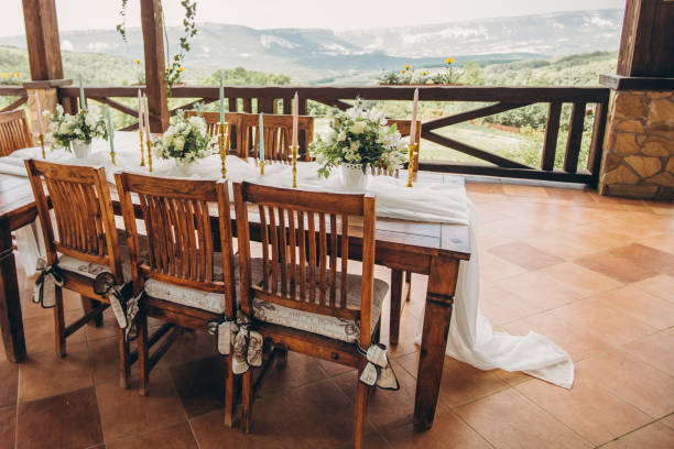 istock Decorated wedding table for the newlyweds and guests with mountain views. Wedding decor and Floristics. 1215201734