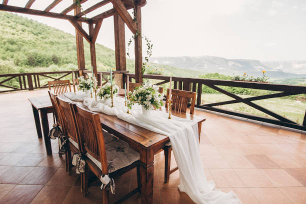 istock Decorated wedding table for the newlyweds and guests with mountain views. Wedding decor and Floristics. 1215201809