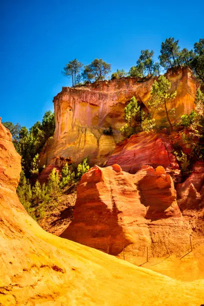 The Ochre Path - le Sentier Les Ocres through, the Red Cliffs of Roussillon Les Ocres, a nature park in Vaucluse, Provence, France