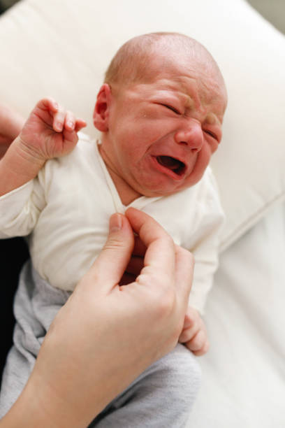 istock Two day old baby boy crying 1215203645