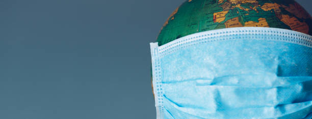 istock Earth globe with face mask protection. Universal coronavirus medical concept 1215205016