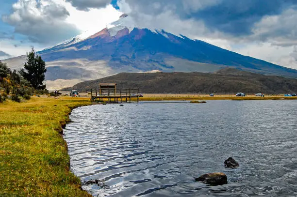 View of the Limpiopungo lagoon with the Cotopaxi volcano in the background  on a cloudy and overcast afternoon - Ecuador