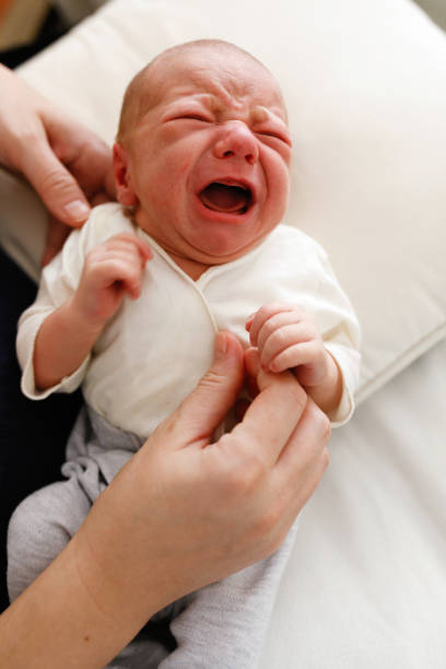 istock Two day old baby boy crying 1215207992