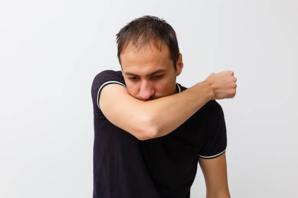 istock Close-up of a young man having a cough 1215209611