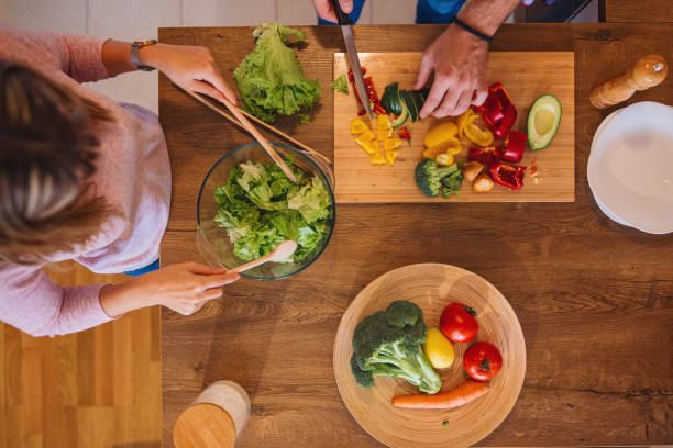 istock Directly above view of a vegan couple making dinner 1215214521