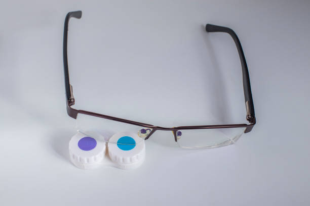 istock Contact lenses in a case and glasses 1215214707