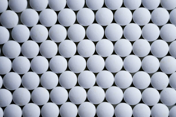 istock White tablets folded on a pharmaceutical factory production line 1215215369