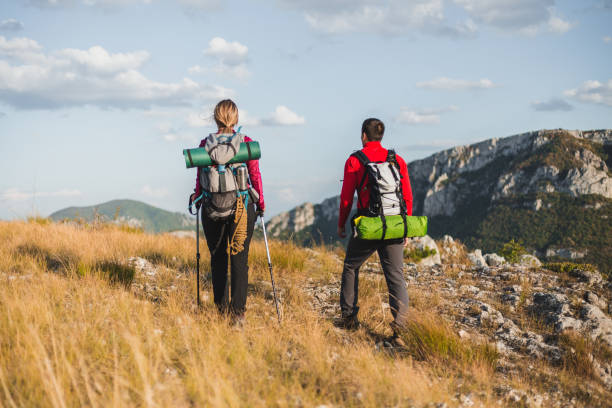istock Couple enjoying blissful silence on a mountain path 1215215442