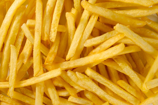 French fried fries close-up. Background, potato chips.