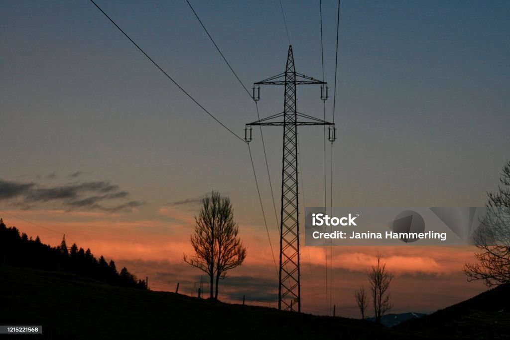 Powerpole sunset Sunset Austria Stock Photo