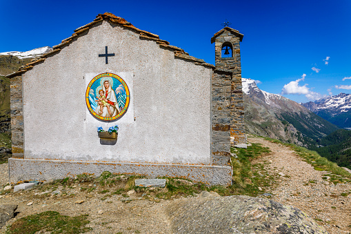 Chapel church above Idyllic Dolomites Alpine landscape – Gran Paradiso, Italy