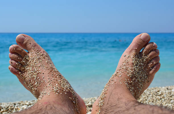 Sandy feet on a tropical beach