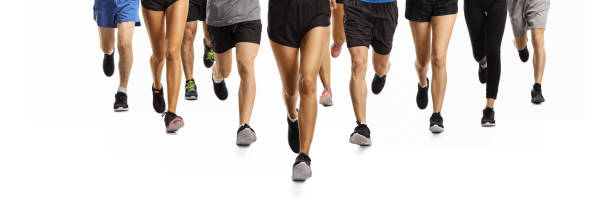 istock Close up shot of people running 1215227765