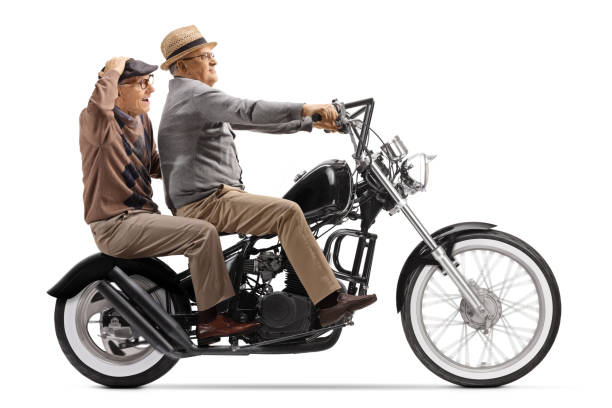 istock Elderly men riding on a custom chopper 1215228095