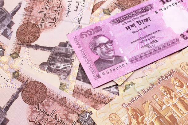 A Ten Taka Note From Bangladesh On A Background Of Egyptian One Pound Bills  Stock Photo - Download Image Now - iStock