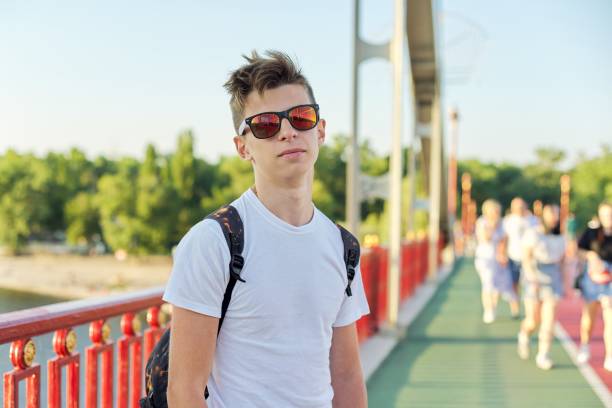 teen boy 15 years old with fashionable hairstyle sunglasses looking at camera - teenager 14 15 years 13 14 years cheerful imagens e fotografias de stock