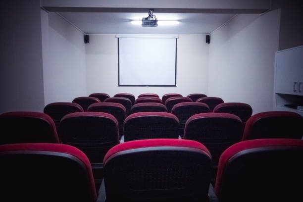 istock Empty screen in conference room, meeting room, boardroom, Classroom, Office, with white projector board 1215232842