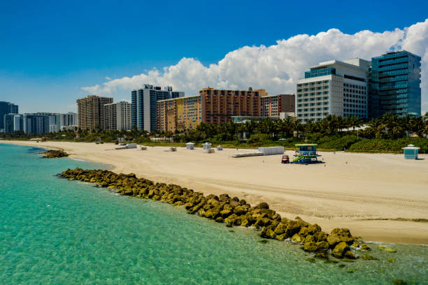 istock Miami Beach coastal scene with rocks and condominiums 1215236420