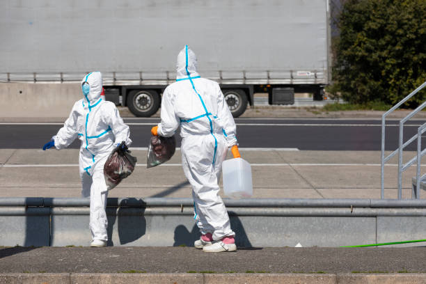 istock Healthcare workers in coveralls working from temporary testing locations 1215236515
