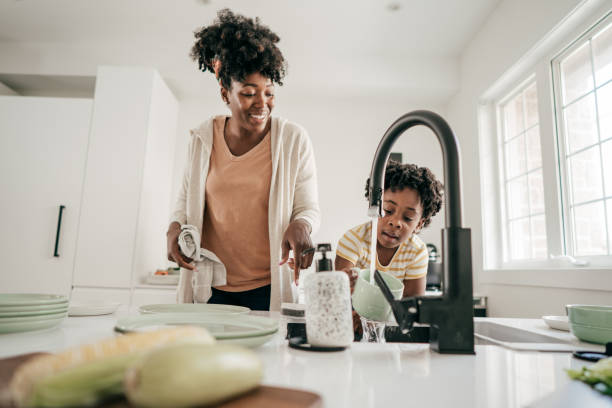 istock Washing the dishes with mom 1215236598
