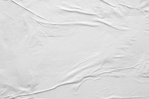 istock Blank white crumpled and creased paper poster texture background 1215236655