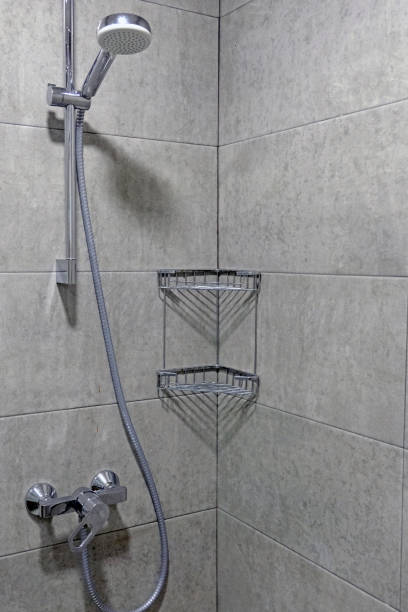 istock Shower cubicle with gray tiles. 1215238910