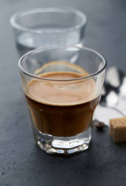 istock Coffee with milk on dark stone background. Close up. 1215240451