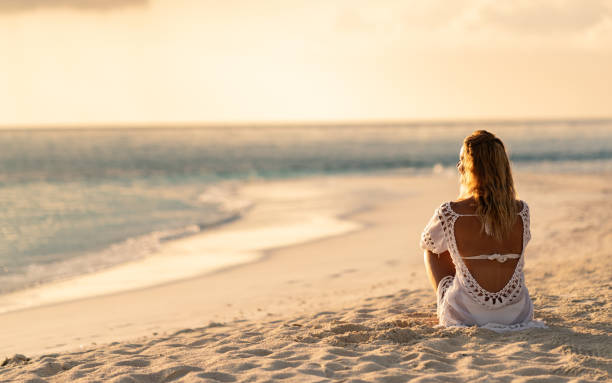 istock Rear view woman looking sea 1215240518