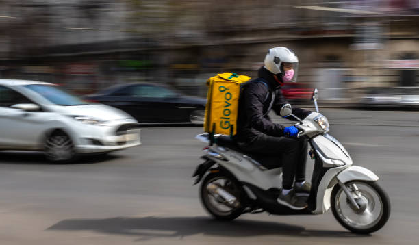 Food delivery courier - state of emergency due to coronavirus - Bucharest, Romania stock photo